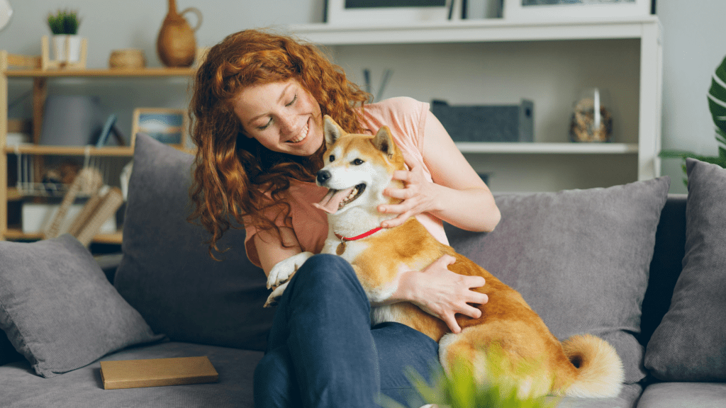Woman on the sofa with her pet dog